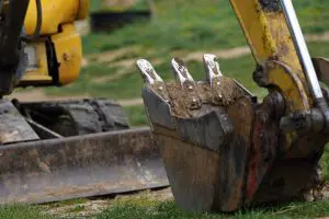 Helena MT excavation contractor backhoe bucket digging at construction site