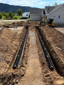 Septic tank installation site by Schaefer Excavating in Helena, MT, featuring trench lines and tank placement