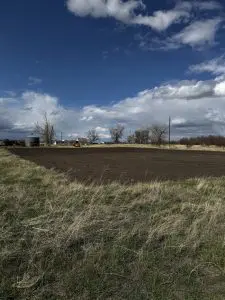 Completed site prep with leveled ground and graded surface in Montana