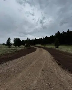 Road grading project in Butte, MT completed by Schaefer Excavating using heavy equipment for level and durable access.