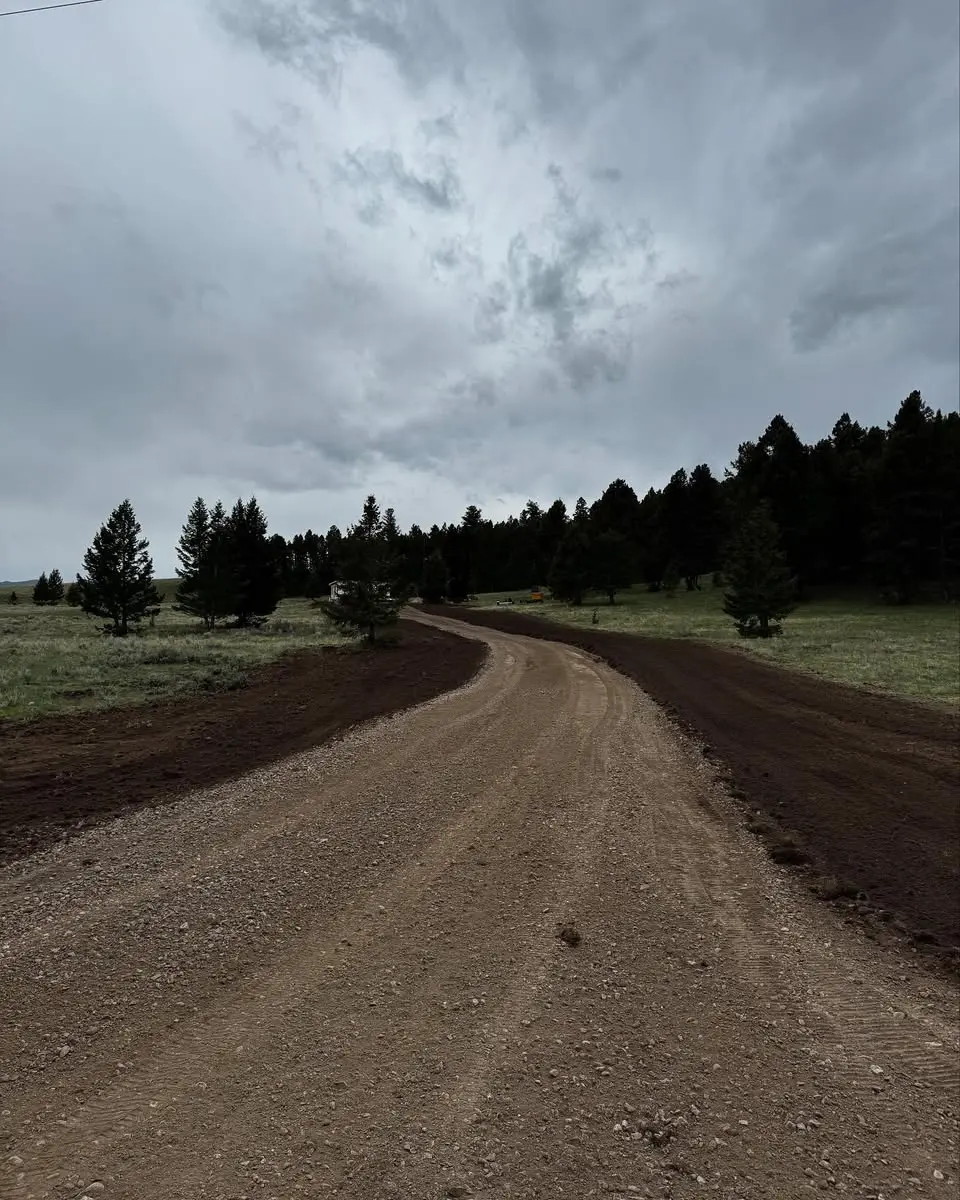 Road grading project in Butte, MT completed by Schaefer Excavating using heavy equipment for level and durable access.