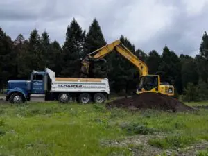 Septic excavation contractor Butte MT loading excavation material with heavy equipment by Schaefer Excavating
