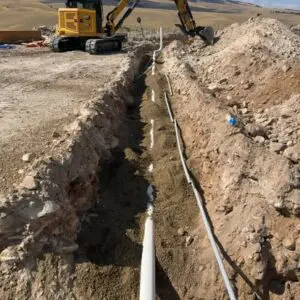 Utility trenching Butte MT excavation equipment preparing a trench for underground water, sewer, or utility lines.