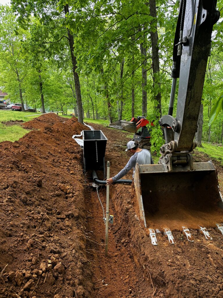 Trevon Schaefer, owner of Schaefer Excavating in Helena, Montana, working on trench excavation