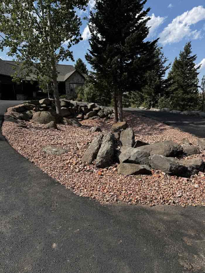 Front view of a home with driveway and landscaping by Schaefer Excavating