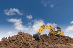 Excavation crew operating heavy equipment in Helena, Montana