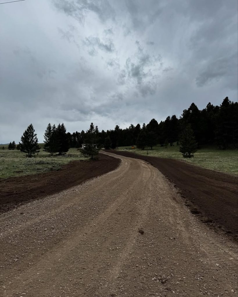 Road grading in progress by Schaefer Excavating in Helena, MT using heavy equipment
