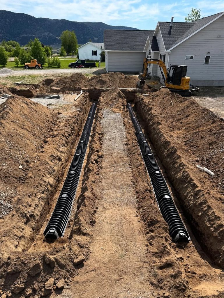 Septic tank installation site by Schaefer Excavating in Helena, MT, featuring trench lines and tank placement