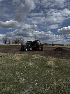 Dozer and dump truck preparing construction site in Montana