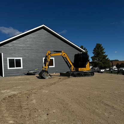 Final excavation work with backhoe at residential site by Schaefer Excavating in Butte, MT