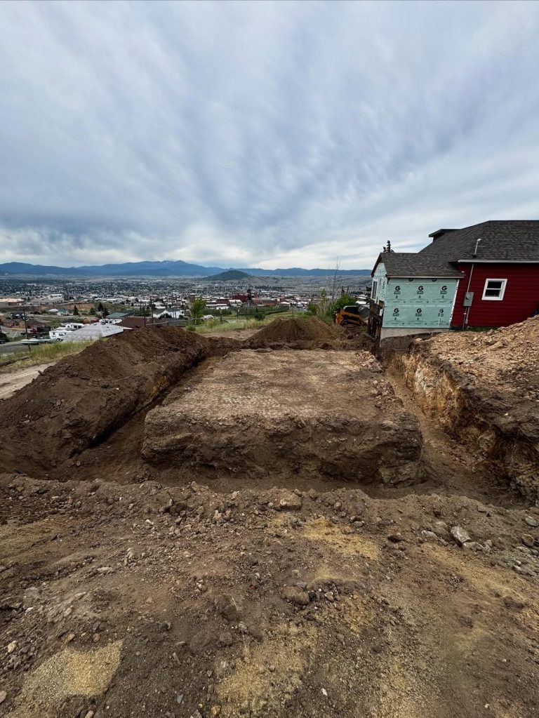Excavator digging a trench for a septic system