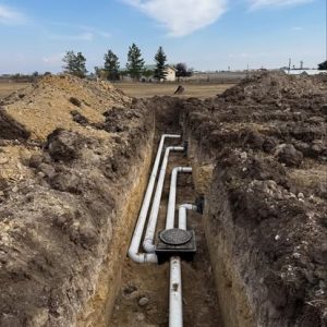Exposed septic tank plumbing lines during installation in Butte, Montana