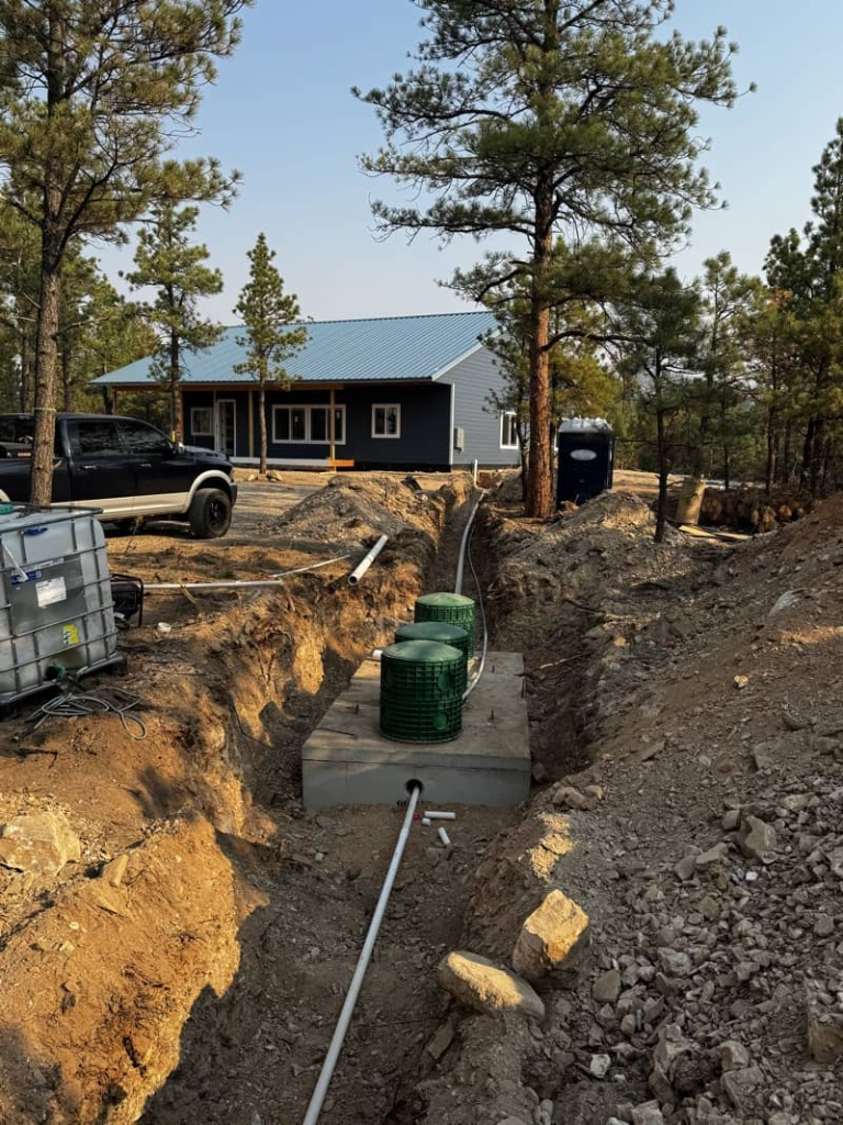 Septic tank installation with exposed plumbing lines in Helena, Montana