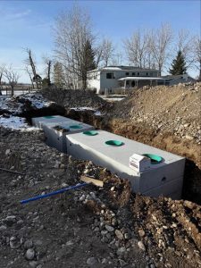 Septic tank installation Butte MT concrete tank placement Schaefer Excavating